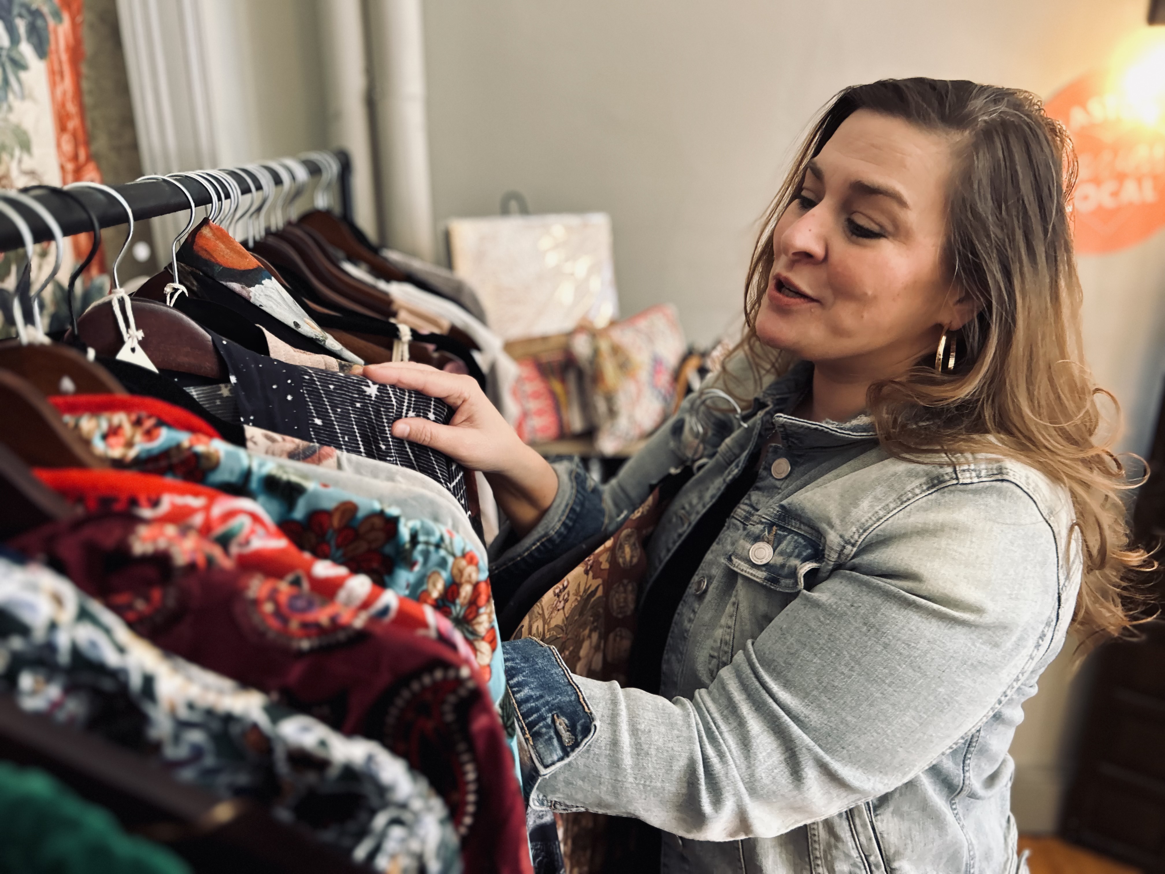 Marisa McFadden curating clothing at Creative Spirit